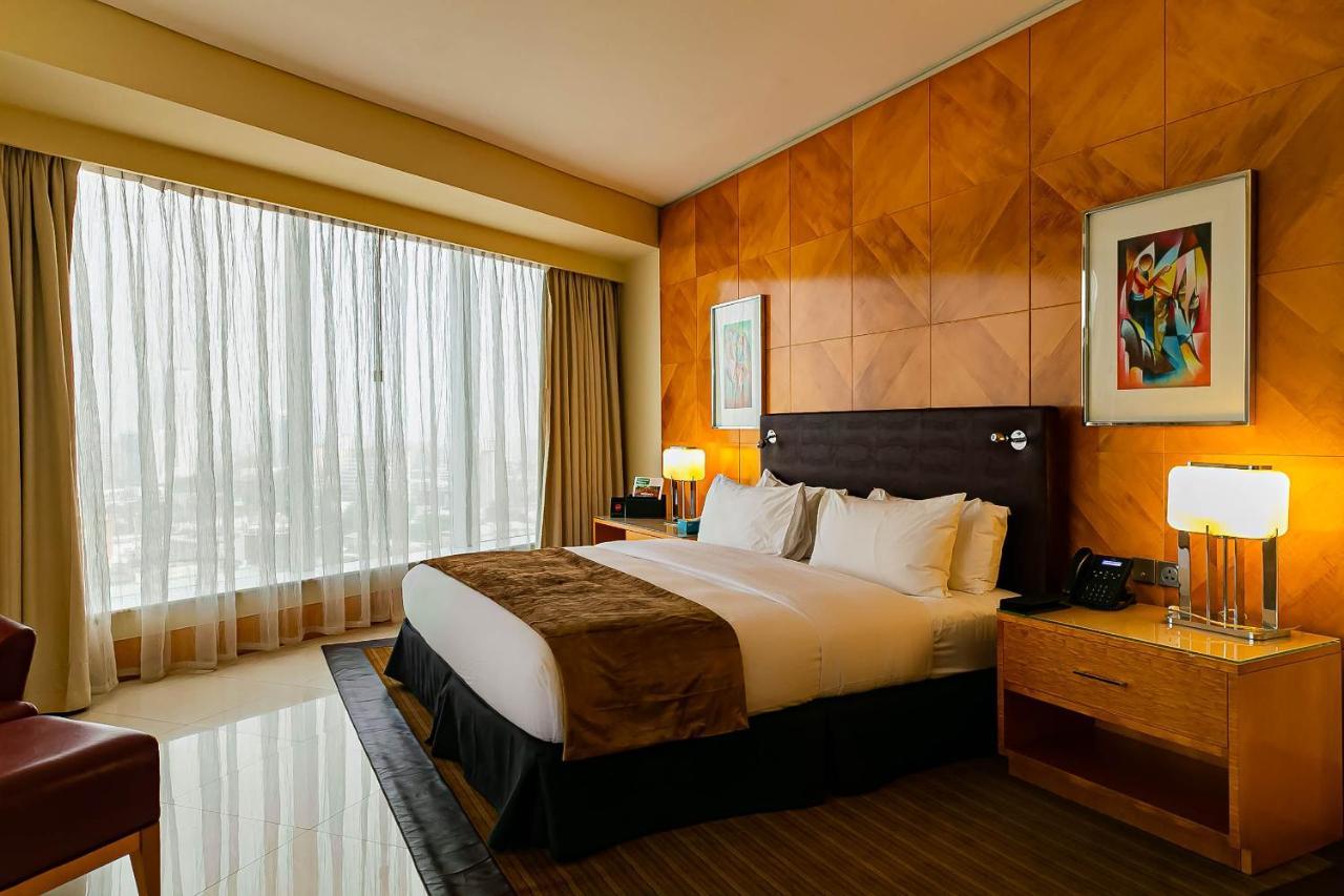 Lagos Continental Hotel Екстериор снимка A bedroom at the Ritz-Carlton, Dubai